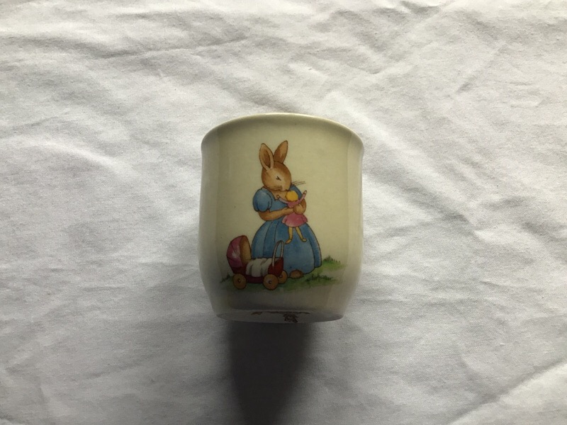 Royal Doulton Bunnykins Eggcup Playing with doll and pram & Holding hat and coat